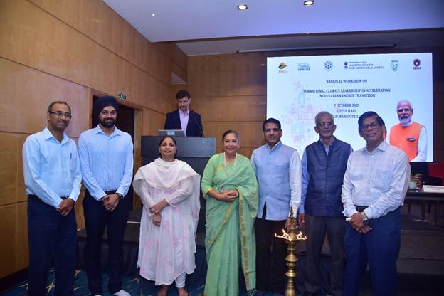 A group of people standing in front of a projector screenAI-generated content may be incorrect.